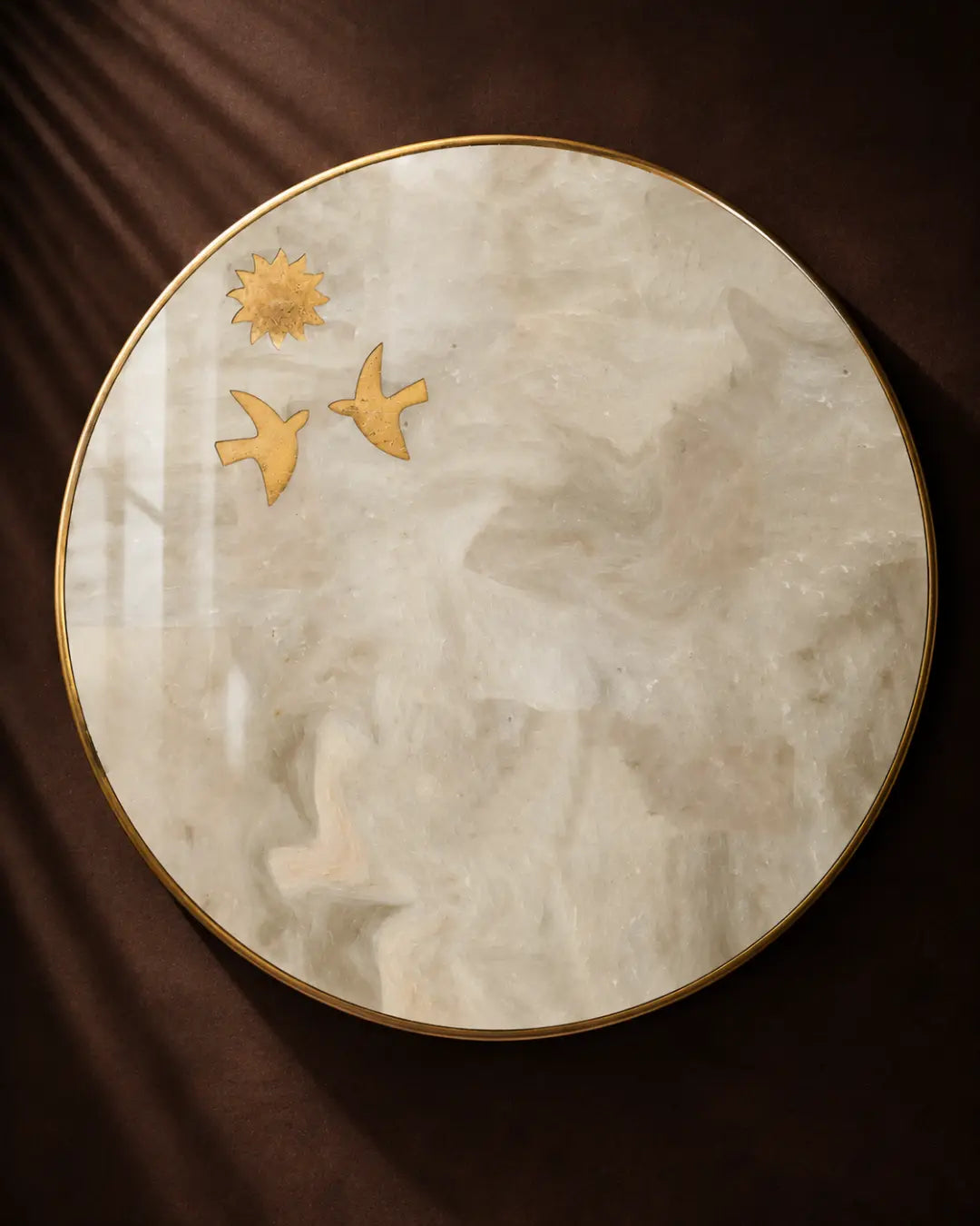 Round Kamoor white marble table top with brass bird and sun inlay motifs