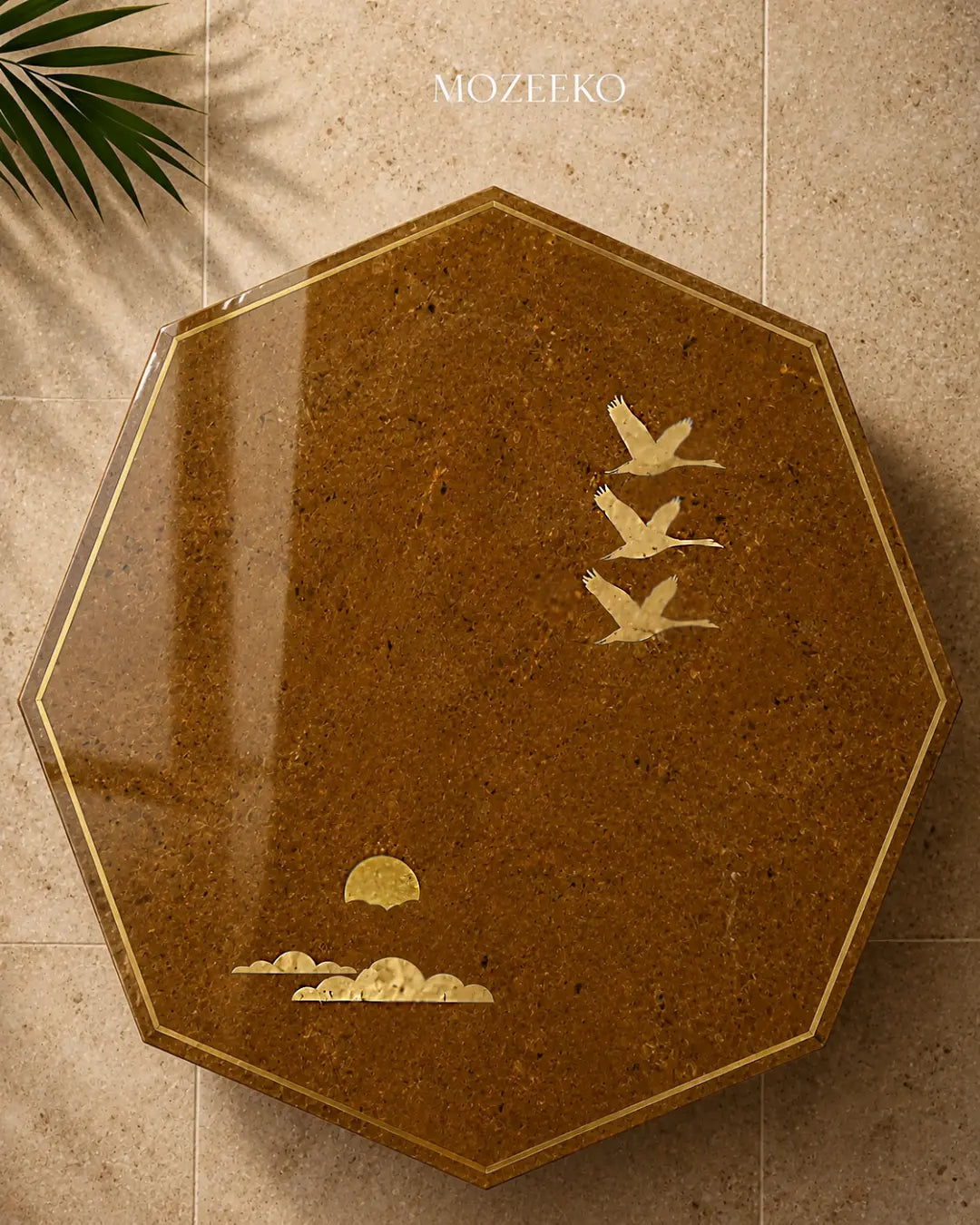 golden marble table top with brassbird and cloud inlay and brass sun motif