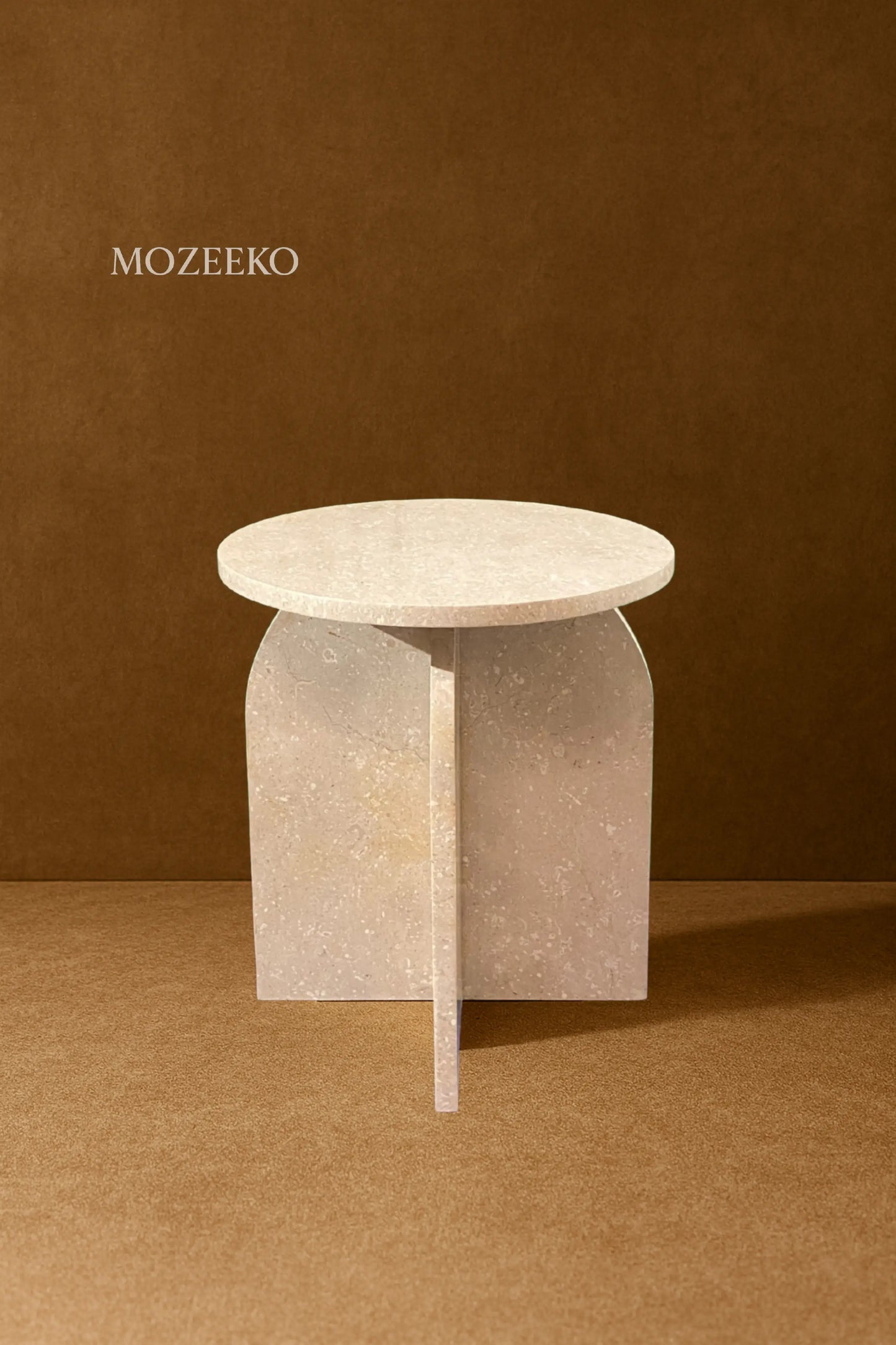 "Cream Tippi marble accent table with round top and wide sculptural base – handcrafted, 19 inches tall and 15.75 inches diameter."