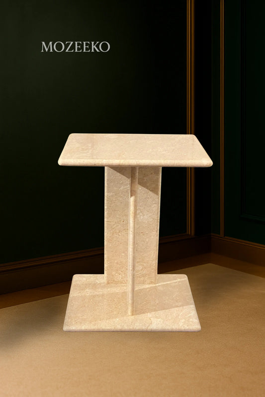 Cream Tippi marble accent table with platform base, featuring 15.75-inch top and 19-inch height, handcrafted by Mozeeko.