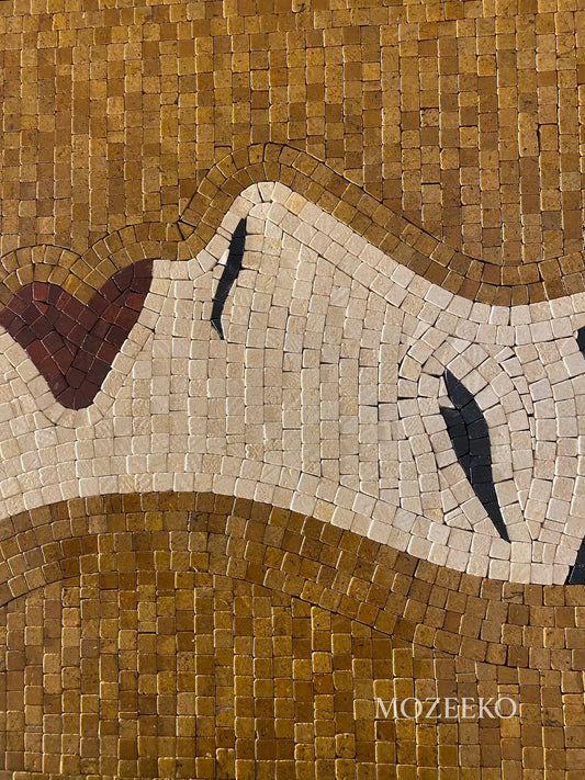 Close-up of a woman’s profile formed from hand-cut golden and cream marble tesserae