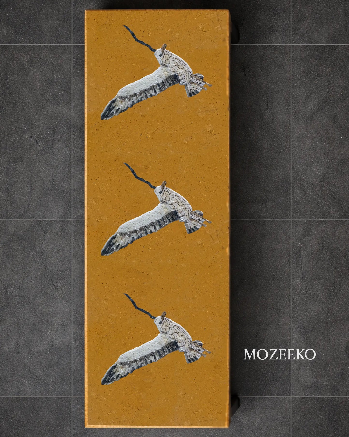 Golden marble vertical slab with hand-inlaid marble mosaic birds, custom tabletop design by Mozeeko