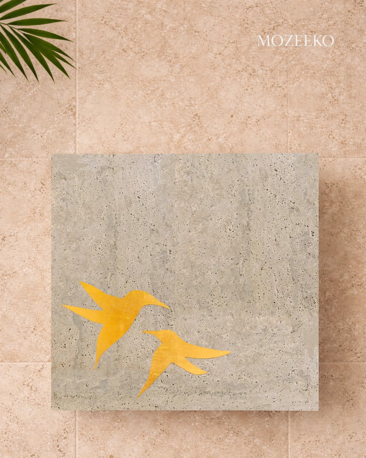 tabletops with brass birds inlaid in travertine