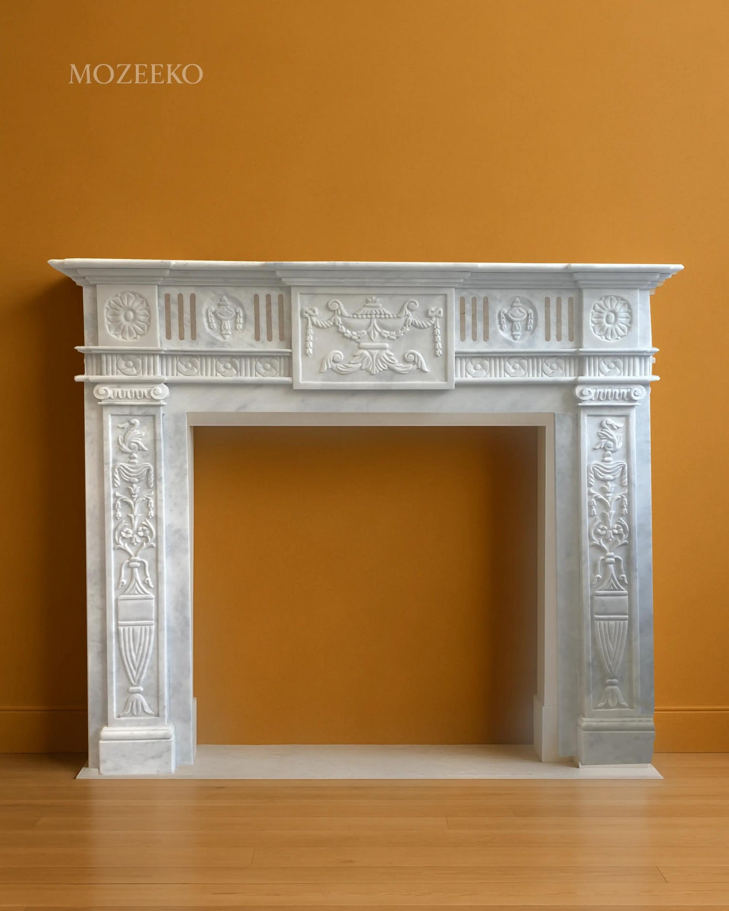 Handcrafted French-style marble fireplace in Ziarat white marble with classical carved details and architectural proportions