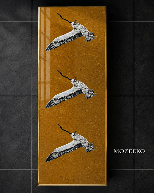 Golden marble vertical slab with hand-inlaid marble mosaic birds, custom tabletop design by Mozeeko