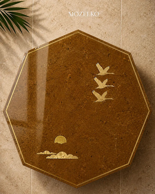 golden marble table top with brassbird and cloud inlay and brass sun motif
