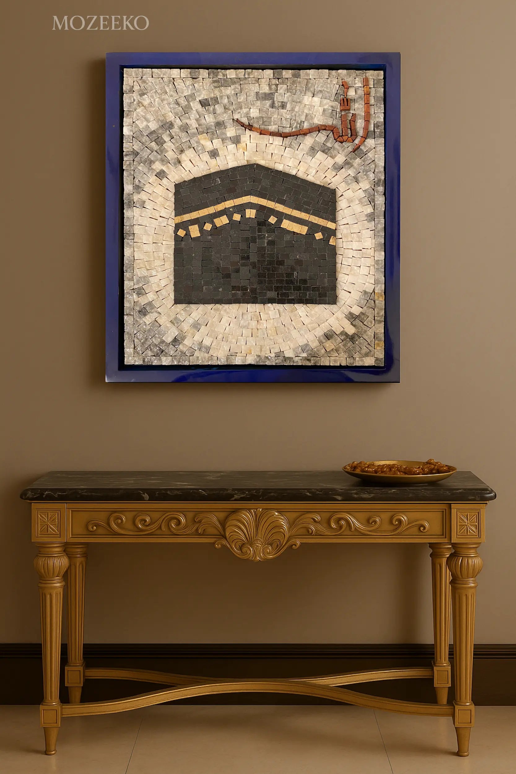 Mozeeko Ashna Collection wall art showing Kaaba mosaic with “Allah” calligraphy, framed in blue, displayed above a golden console table.
