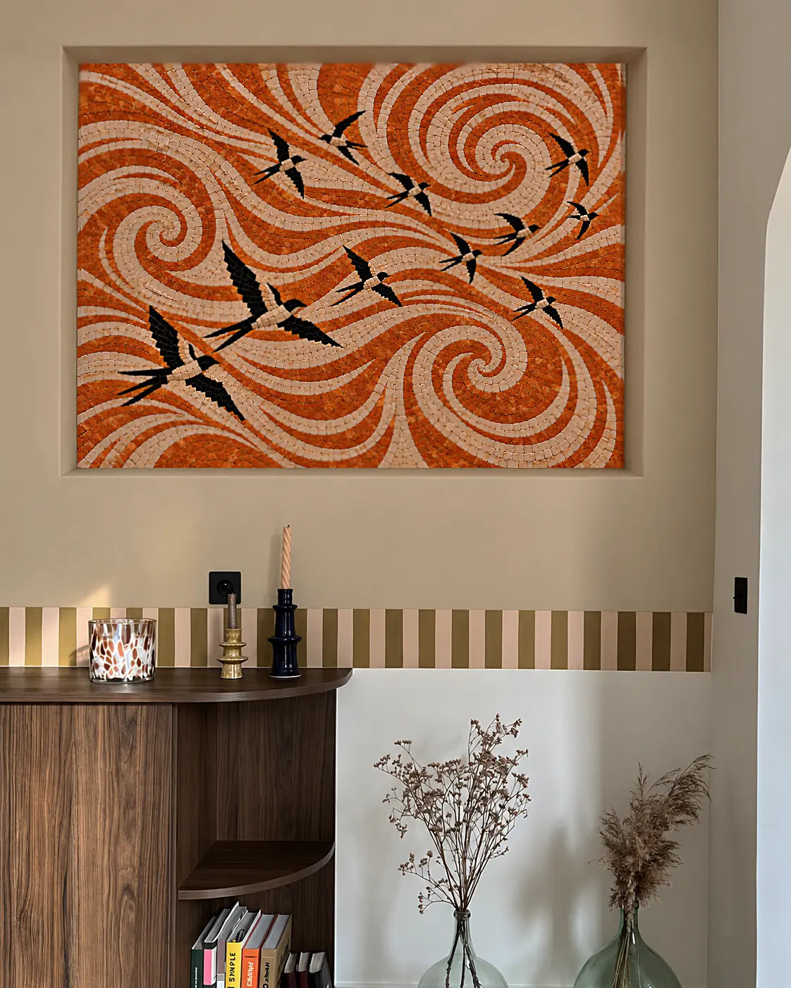 Black and cream birds flying across flowing terracotta and cream marble spirals, shown in a recessed beige wall niche mockup.