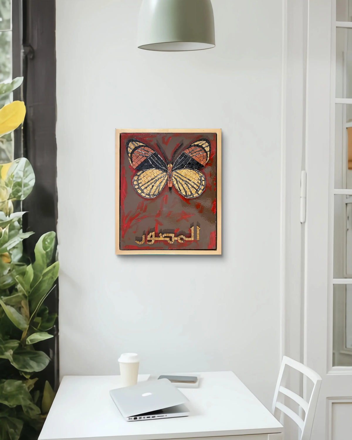 Handmade marble mosaic artwork featuring a butterfly motif and Arabic calligraphy Al-Muṣawwir over an abstract acrylic painted background, framed in a golden floating wooden frame by Mozeeko Atelier.2