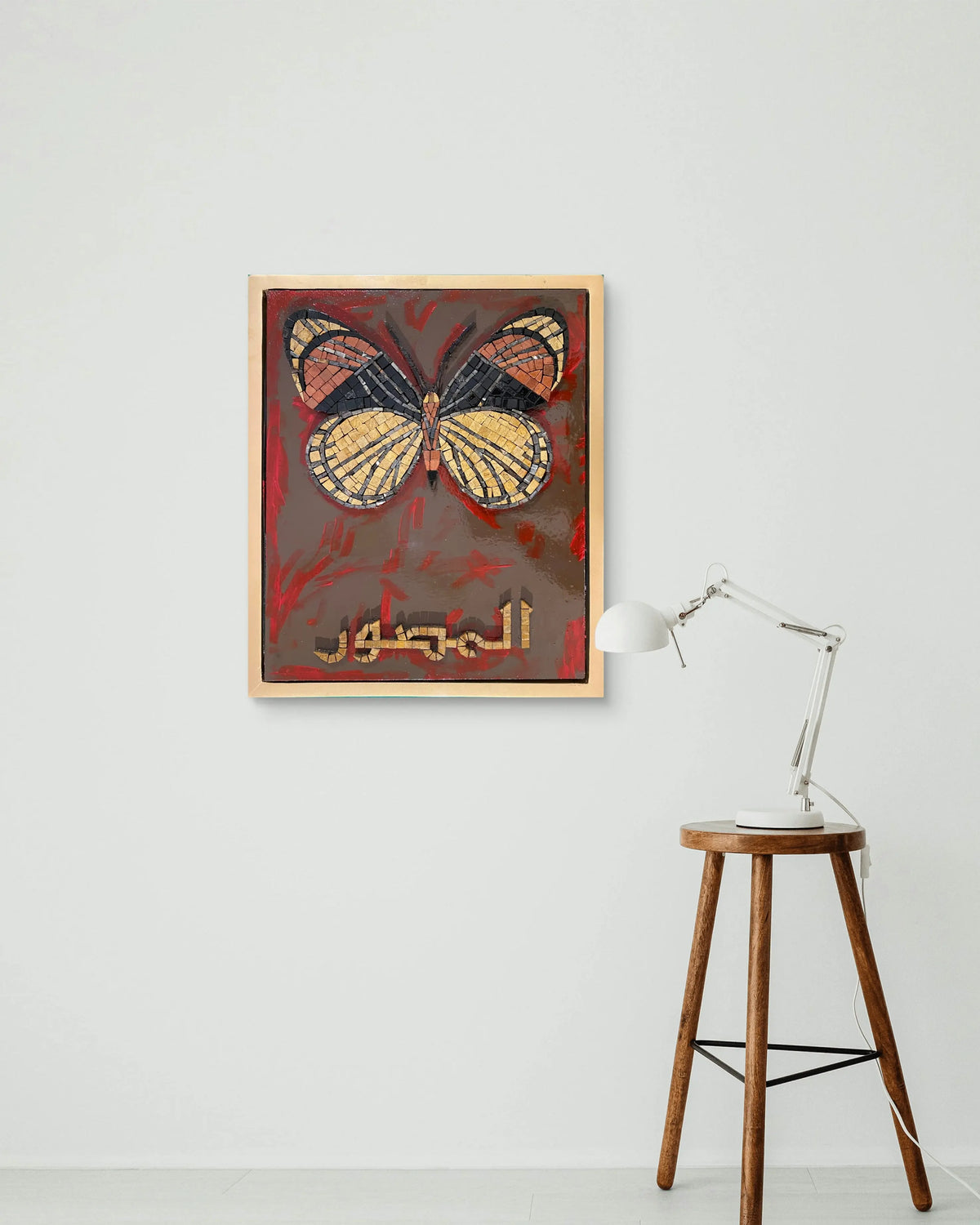 Handmade marble mosaic artwork featuring a butterfly motif and Arabic calligraphy Al-Muṣawwir over an abstract acrylic painted background, framed in a golden floating wooden frame by Mozeeko Atelier.3