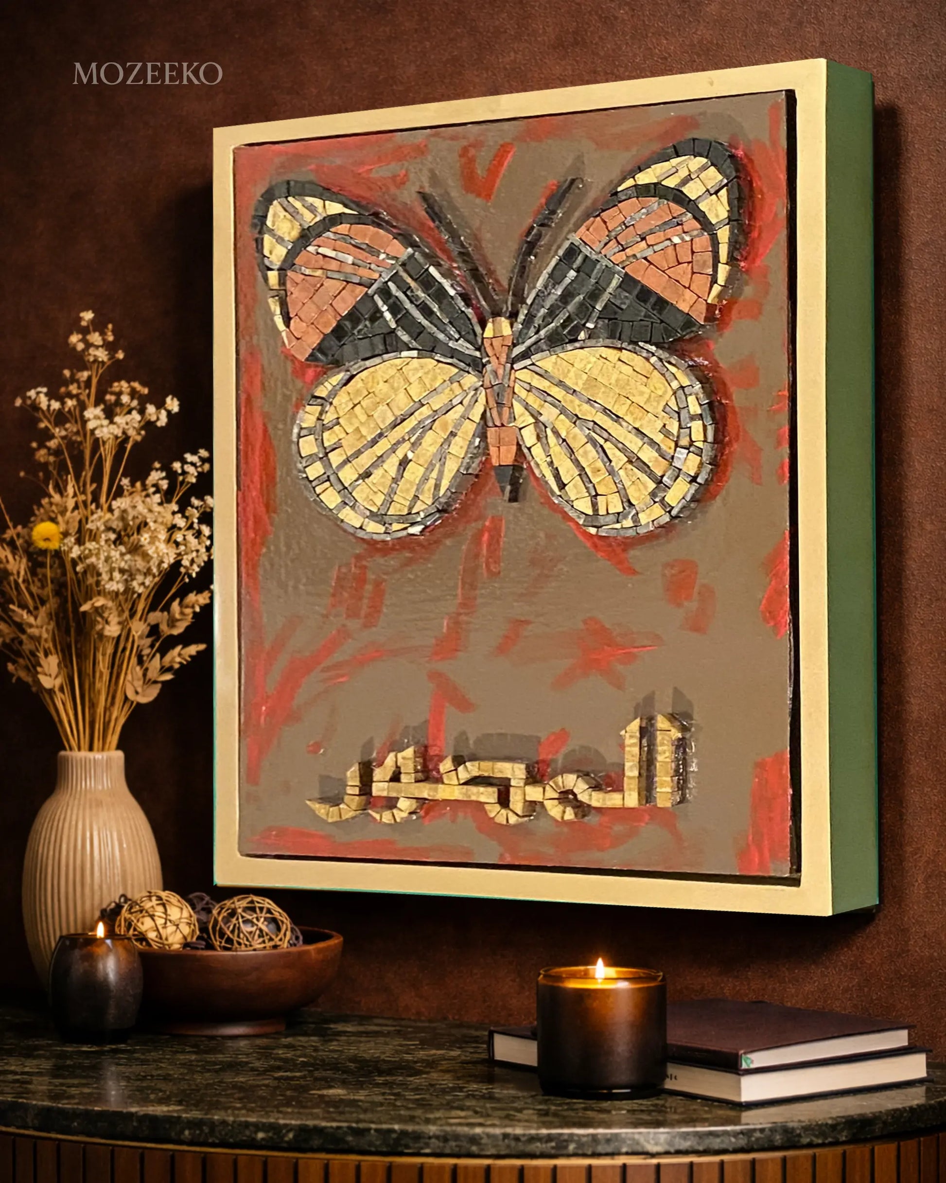 Handmade marble mosaic artwork featuring a butterfly motif and Arabic calligraphy Al-Muṣawwir over an abstract acrylic painted background, framed in a golden floating wooden frame by Mozeeko Atelier.sideview