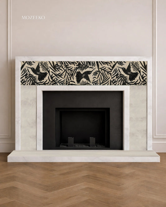 French-style Ziarat White Supreme marble fireplace featuring an inlaid black bird mosaic frieze set within foliage, handcrafted and made to order by Mozeeko.