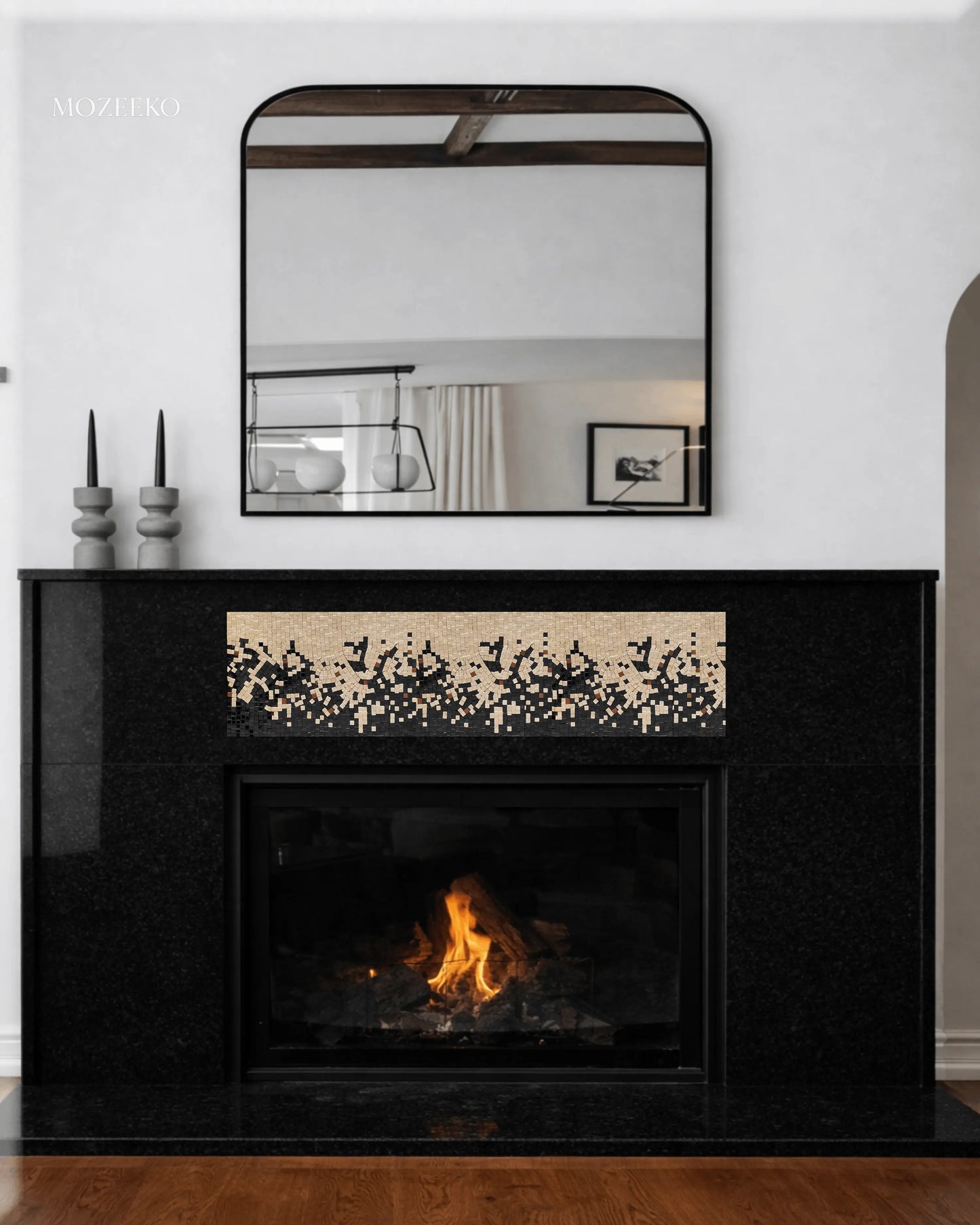 Jet black granite fireplace with handcrafted mosaic inlay panel, featuring a modern architectural design by Mozeeko.