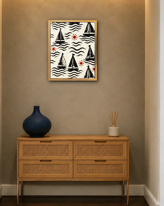 Black sailboats marble mosaic wall art displayed in a golden frame above a wooden console.
