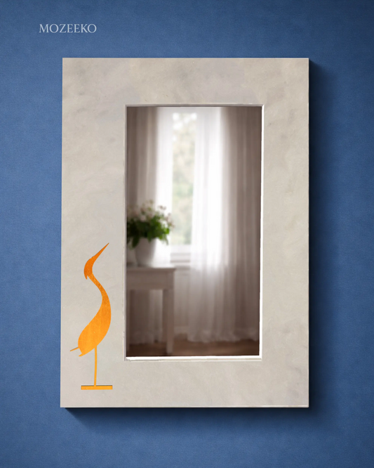 Kamoor White marble mirror with stylized brass bird inlay on a minimalist stone frame