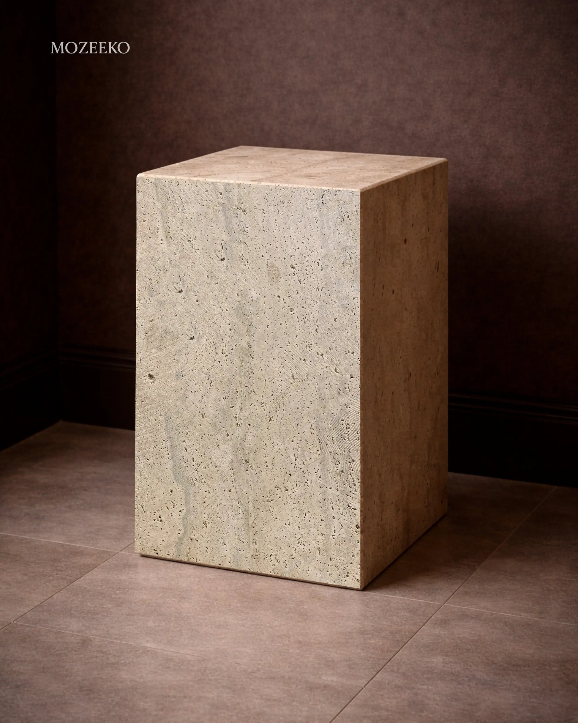 Travertine marble plinth with mitered corners and architectural form, shown as a sculptural accent pedestal
