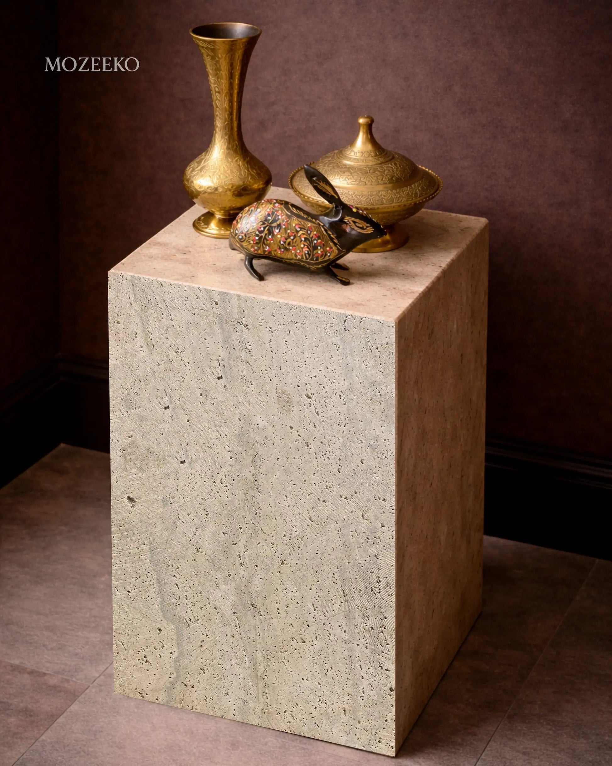Travertine marble plinth with mitered corners and architectural form, shown as a sculptural accent pedestal-brass