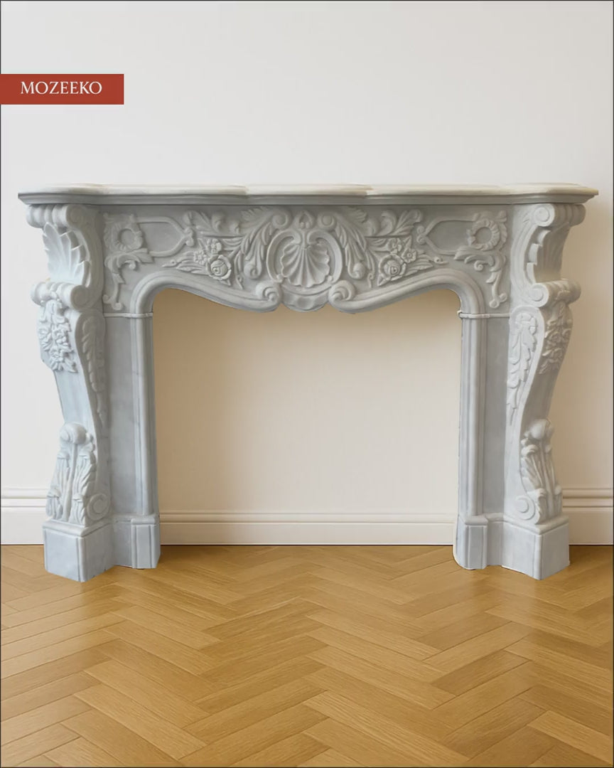 “Video of hand-carved Super White marble fireplace by Mozeeko, showcasing French Rococo carving details, flowing curves, and premium stone craftsmanship.”