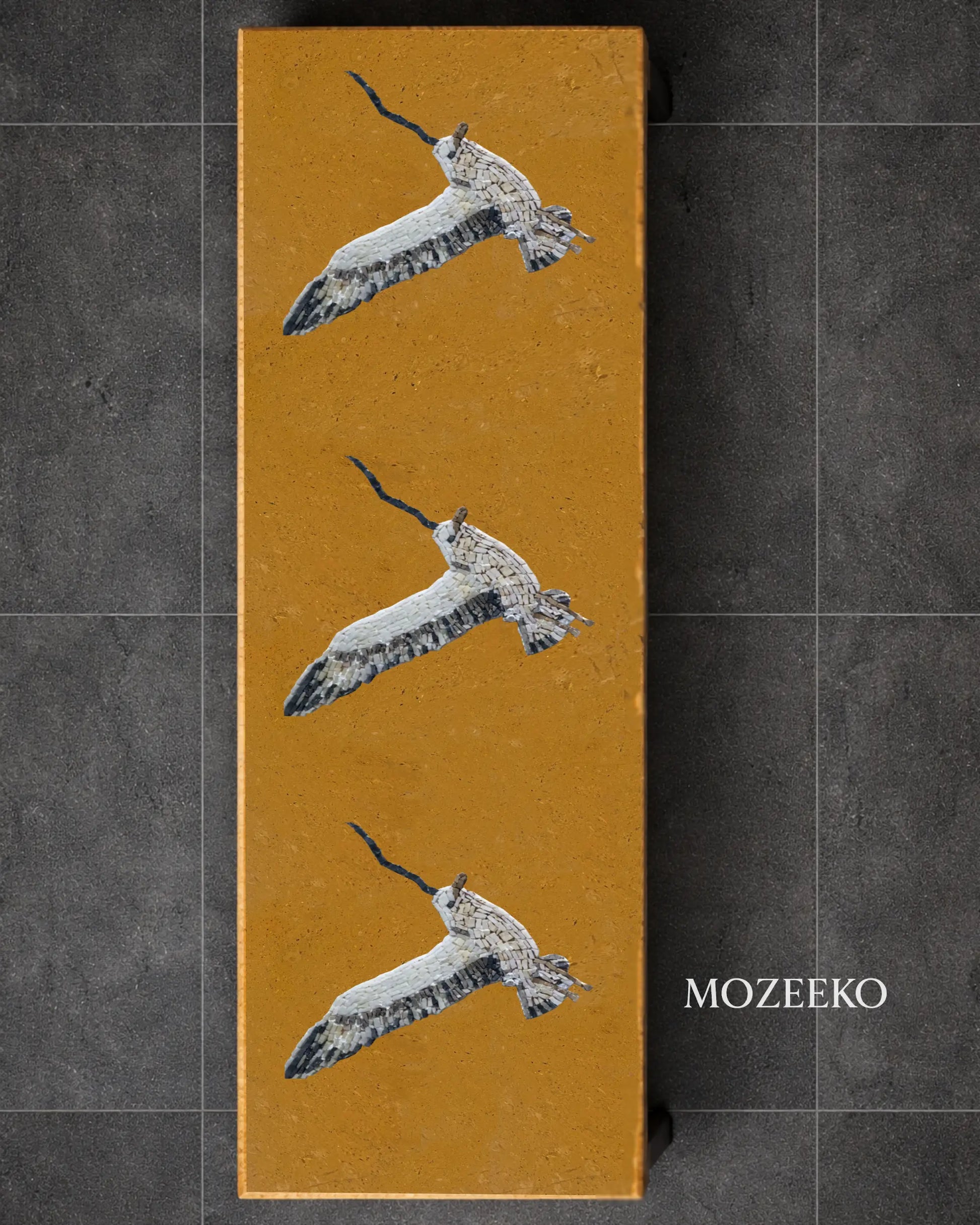 Golden marble vertical slab with hand-inlaid marble mosaic birds, custom tabletop design by Mozeeko