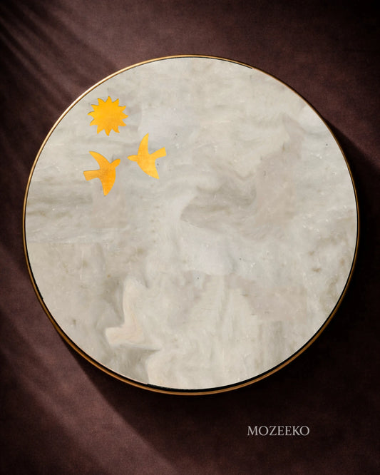 Round Kamoor white marble table top with brass bird and sun inlay motifs