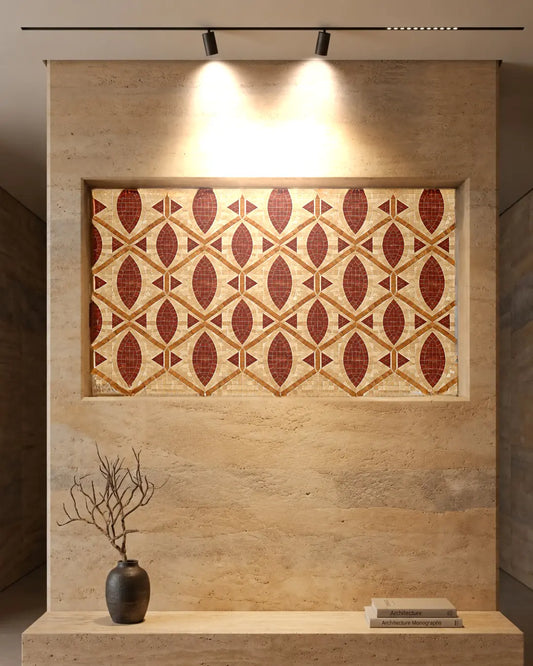 Terracotta, golden and cream geometric marble mosaic panel displayed in a recessed travertine wall niche