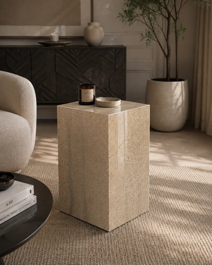 Travertine marble plinth with mitered corners and architectural form, shown as a sculptural accent pedestal