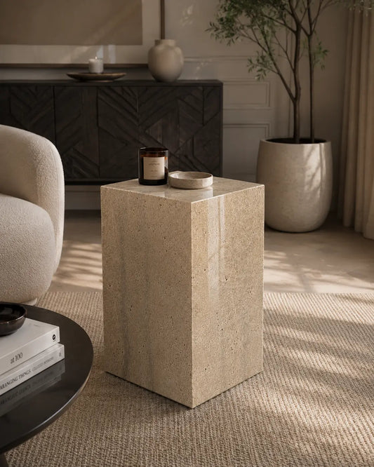 Travertine marble plinth with mitered corners and architectural form, shown as a sculptural accent pedestal