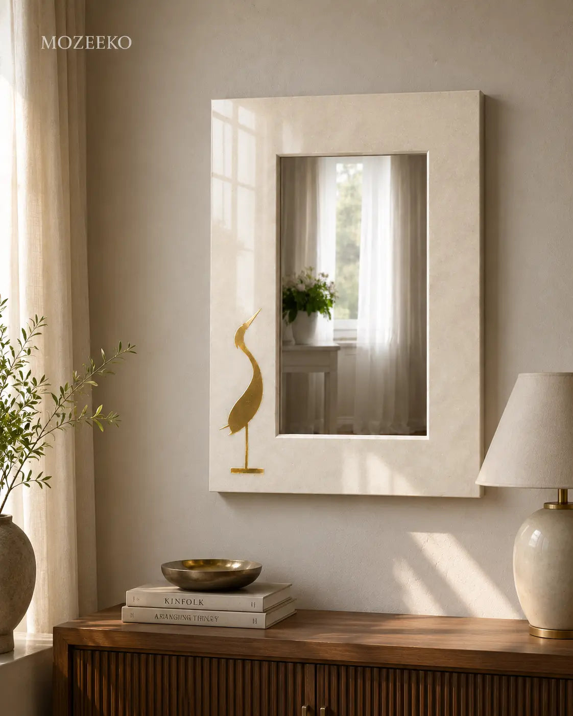 Kamoor White marble mirror with stylized brass bird inlay on a minimalist stone frame